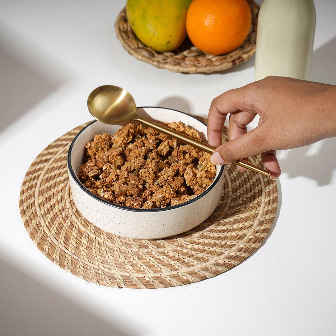 Ceramic bowl with metal spoon