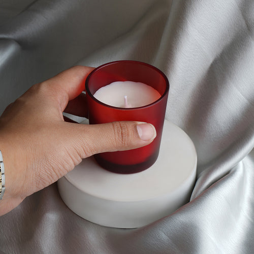 Candle in red glass