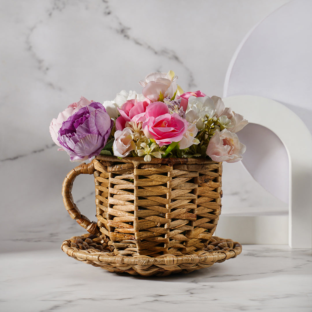 Palm leaf tea pot with faux flowers - decor