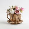 Palm leaf tea pot with faux flowers - decor